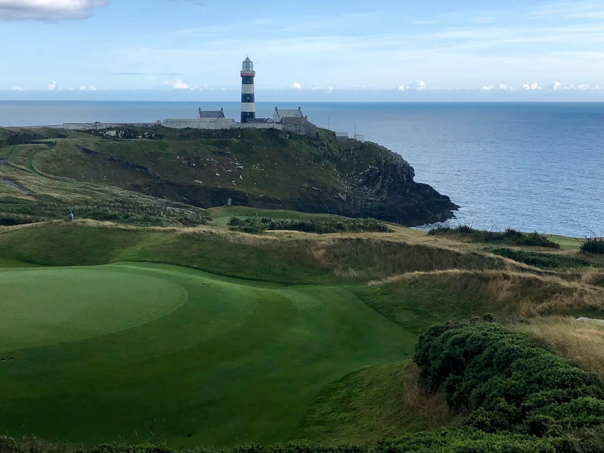 A green at Old Head Golf Links beneath the lighthouse on Ireland’s Atlantic coast